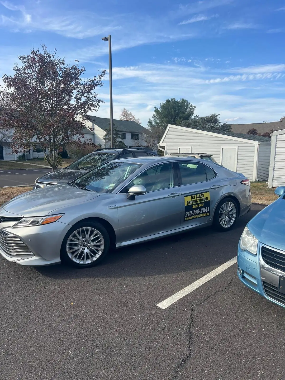 Silver dual-control Camry used for evening driving lessons