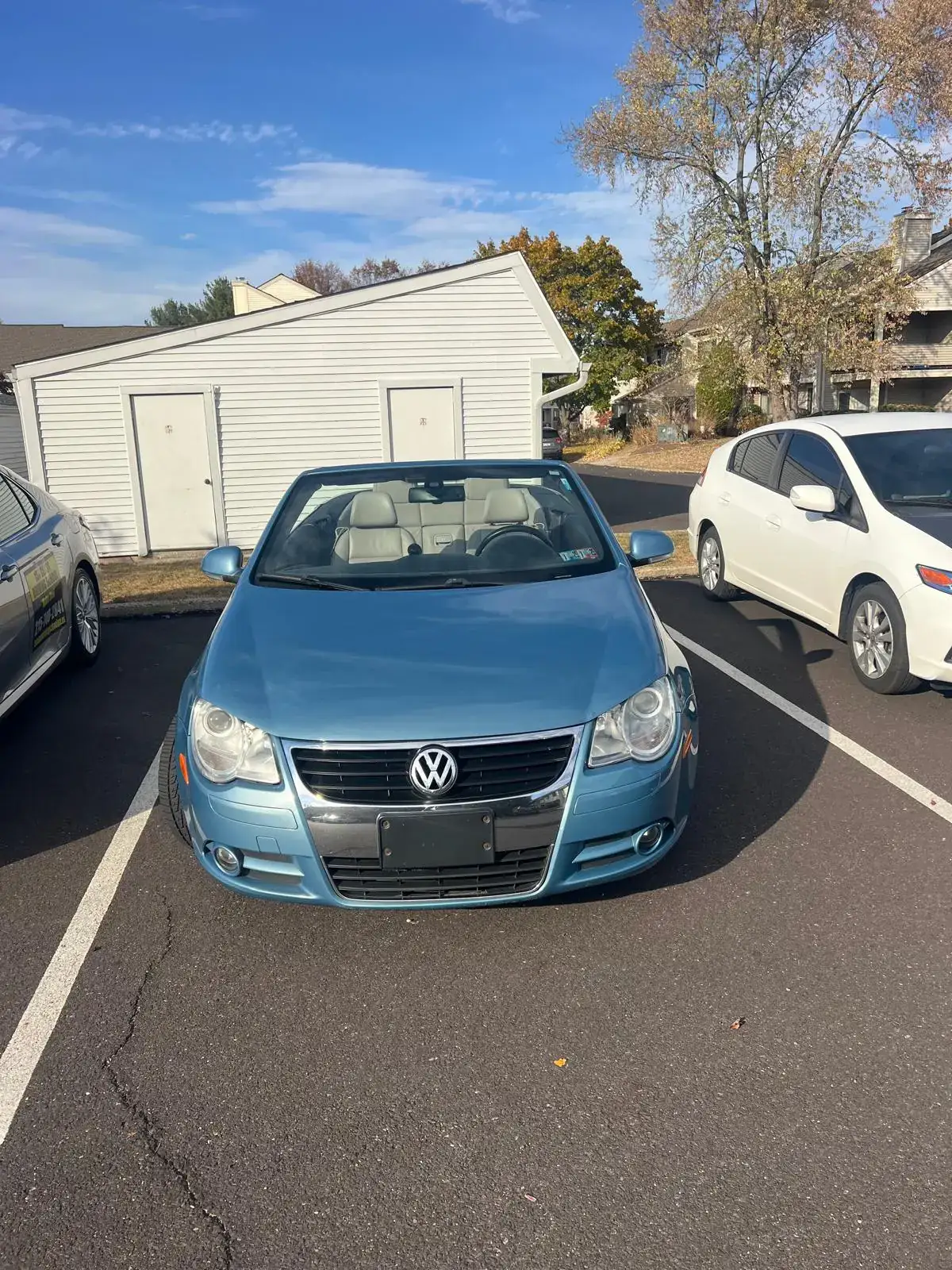 Training car parked beside another vehicle in a practice lot