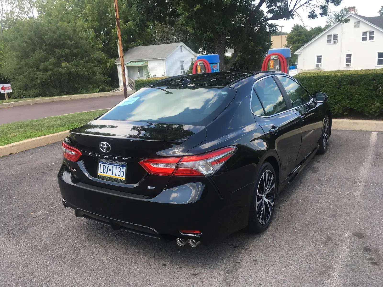 Rear view of the dual-control training car on a residential street